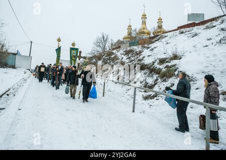 Ukraine, city of Romny, January 19, 2013: Procession of the Holy Cross to the baptismal font on the feast of the Baptism of the Lord. Epiphany. Feast Stock Photo