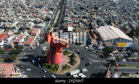 Nezahualcoyotl, Mexico. 12th Nov, 2024. An aerial view shows the monument of ''El Coyote, '' which has a height of 21 meters, located in Nezahualcoyotl, State of Mexico. The El Coyote statue is created by the Mexican sculptor Enrique Carbajal, known as 'Sebastian, ' who specializes in monumental sculpture, on November 12, 2024, in Mexico City, Mexico. (Photo by Carlos Santiago/ Eyepix Group) (Photo by Eyepix/NurPhoto) Credit: NurPhoto SRL/Alamy Live News Stock Photo