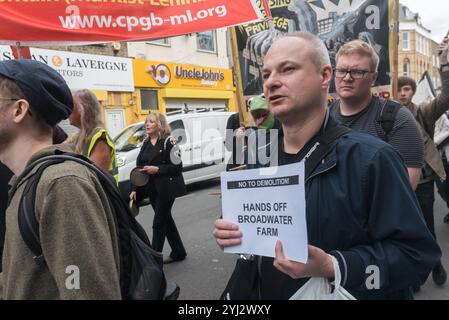 London, UK. 23rd September 2017.A Broadwater Farm resident holds a poster on the march in North London from a rally in Tottenham to Finsbury Park against the so called Haringey Development Vehicle, under which Haringey Council is making a huge transfer of council housing to Australian multinational Lendlease. This will result in the imminent demolition of over 1,300 council homes on the Northumberland Park estate, followed by similar loss of social housing across the whole of the borough. At £2 billion, his is the largest giveaway of council housing and assets to a private corporation yet in t Stock Photo