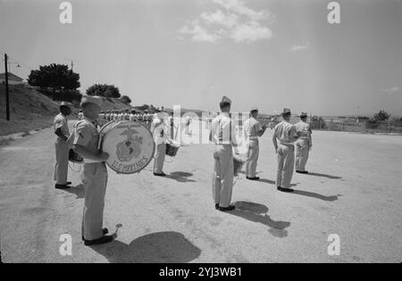 American Marines, some with drums, lined up for inspection at the Guantánamo Bay Naval Base, Cuba. October 1960 Stock Photo