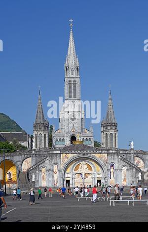 Sanctuary of the Lady of Lourdes, the Rosary Basilica and Rosary Square with Christian Pilgrims and Tourists Lourdes Hautes-Pyrénées France Stock Photo