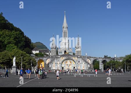 Sanctuary of the Lady of Lourdes, the Rosary Basilica and Rosary Square with Christian Pilgrims and Tourists Lourdes Hautes-Pyrénées France Stock Photo