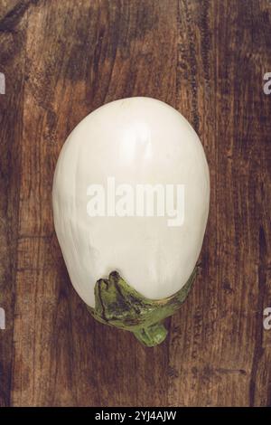 White eggplant, on a wooden background, top view, raw eggplant, no people Stock Photo
