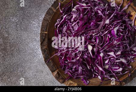 Red cabbage, sliced, in a wooden salad bowl, top view, no people Stock Photo