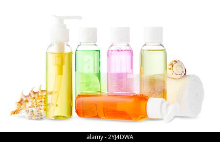 Assorted skincare products displayed on a white surface with a seashell Stock Photo