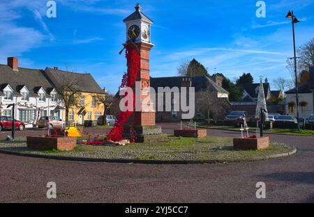 Poppy covered Town Square clock in Usk South Wales. Commemorating  Britain's military dead. Stock Photo