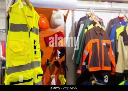 Special protective, work clothes, various jackets for builders, workers of the oil and gas industry on display in the store Stock Photo