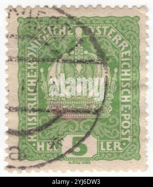 AUSTRIA - 1916 September 28: 5 heller green postage stamp depicting Imperial Crown of Austria, which was previously used by the monarchs of the Habsburg monarchy. The crown was made in 1602 by Jan Vermeyen as the personal crown of Holy Roman Emperor Rudolf II, and also known as the Crown of Emperor Rudolf II. In 1804 it became the official crown of the newly constituted Austrian Empire. After 1867 it remained the imperial crown of the Cisleithanian part of the Austro-Hungarian Empire. It consists elements possessing symbolic significance: the circlet, the high arch, and the mitre Stock Photo