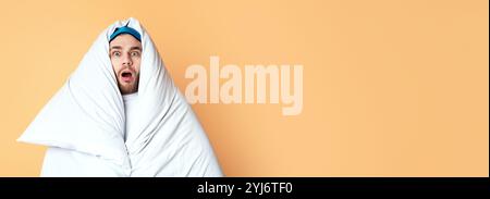 Shocked man in blanket scared. Quarantine, stay at home Stock Photo