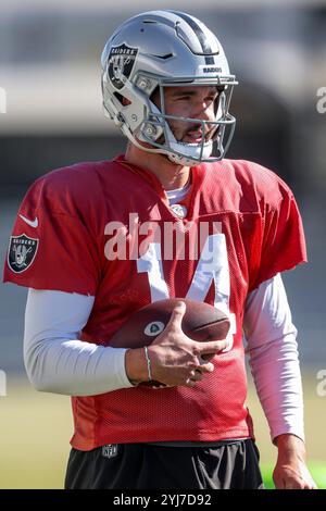 Henderson, NV USA;  Las Vegas Raiders backup quarterback Carter Bradley (14) walks with a football during practice for the on Wednesday, November 13, 2024 at Intermountain Health Performance Center. (Kim Hukari/Image of Sport) Stock Photo