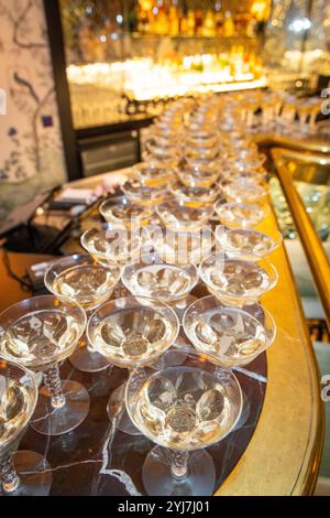 Glasses filled with champagne on a bar Stock Photo