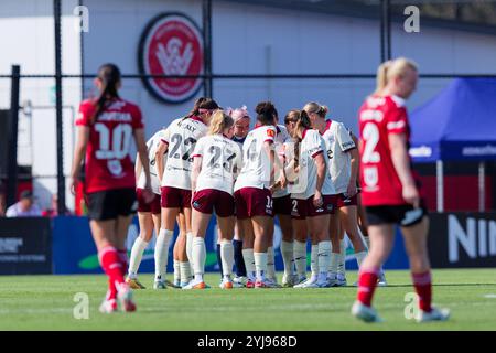 Adelaide United players form a huddle during the A-League Women Rd2 match between the Wanderers and Adelaide at Wanderers Football Park on November 10 Stock Photo