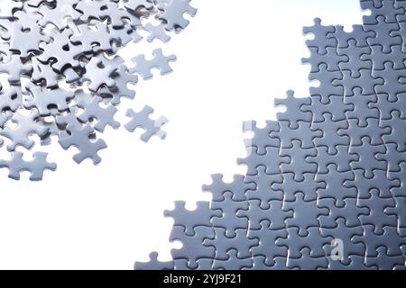 White puzzle in the process of being created Stock Photo