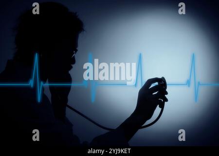 Shadow of male doctor pointing stethoscope and ECG Stock Photo