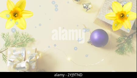 Image of snowflakes on flowers, gift boxes and christmas decorations. digital composite, multiple exposure, winter, holiday, abstract and celebration Stock Photo