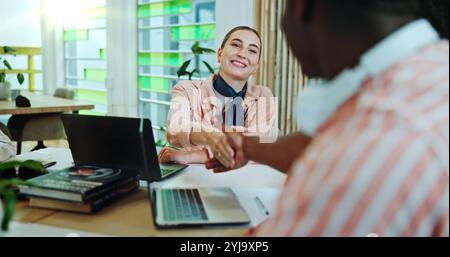 Campus, teamwork and students with handshake for education, english project and studying success. College, friends and woman with shaking hands for Stock Photo