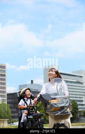 Mother taking her child out on a bicycle Stock Photo