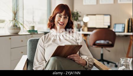 Woman, therapist portrait and clipboard for counselling, help and checklist for support in office. Psychologist, healthcare and happy for advice Stock Photo