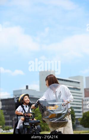 Mother taking her child out on a bicycle Stock Photo