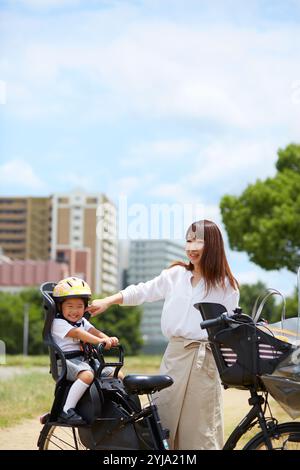 Mother taking her child out on a bicycle Stock Photo