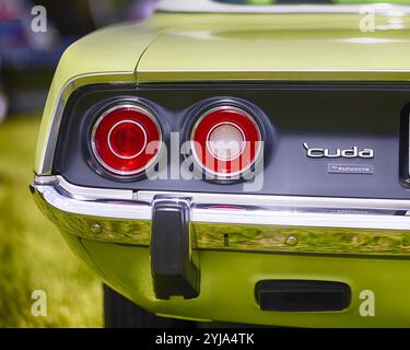 Round Tail Lights and Shiny Chrome Bumper of a Plymuth 1971 Barracuda Muscle Car, New Jersey Stock Photo