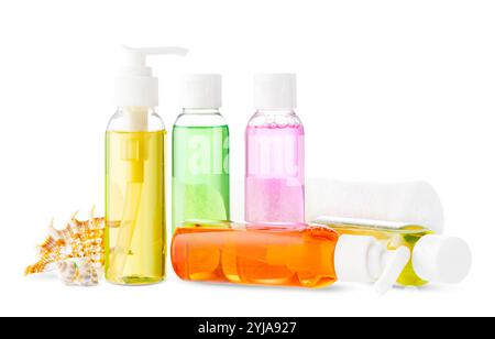 Assorted skincare products displayed on a white surface with a seashell Stock Photo