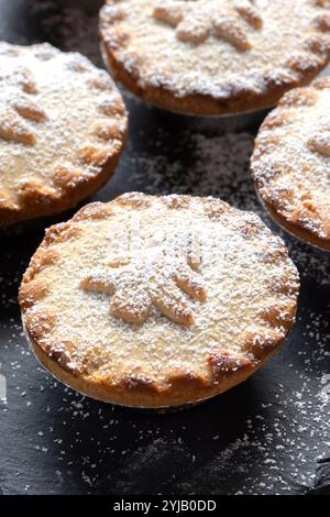 Homemade icing sugar dusted mince pies in baking tray Stock Photo - Alamy