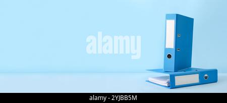 Office folders on light blue background with space for text Stock Photo