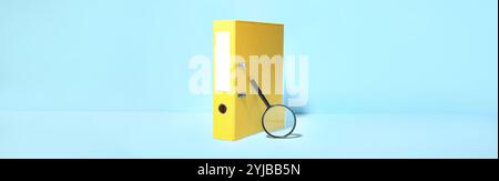 Office folder and magnifying glass on light blue background Stock Photo