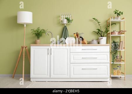 Interior of kitchen with counters, shelf unit and utensils Stock Photo ...