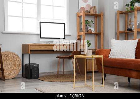 Interior of living room with programmer's workplace Stock Photo