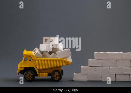 Cargo Track, aerated concrete blocks on grey background. Delivery Building Material. Transportation, Construction industry Stock Photo