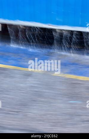 This image features a blurred abstract background with a mix of blue, gray, and yellow hues. The soft, out-of-focus colors create a serene and calming Stock Photo