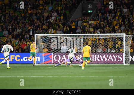 MELBOURNE, AUSTRALIA. 14th November 2024. Pictured: Joe Gauci of Australia dives for the ball after a strike on the Socceroos goal by Marwan Al Sahafi of Saudi during the Group C Australia vs Saudi Arabia AFC World Cup Qualifiers 3rd Round from Melbourne's Rectangular Stadium at AAMI Park on the 14th November 2024. Credit: Karl Phillipson/Alamy Live News Stock Photo