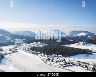 Aerial view of small winter town, snow on the grounds, sunny winter day Stock Photo