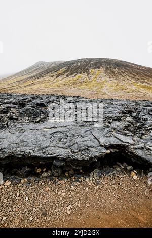 Geldingadalir active Volcano, errupting in 2021, Fagradalsfjall and 2022 -Meradalir. Still hot lava rocks, steam comping up from the grounds. Dark gre Stock Photo