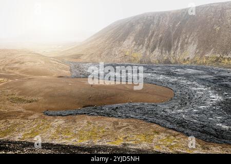 Geldingadalir active Volcano, errupting in 2021, Fagradalsfjall and 2022 -Meradalir. Still hot lava rocks, steam comping up from the grounds. Dark gre Stock Photo