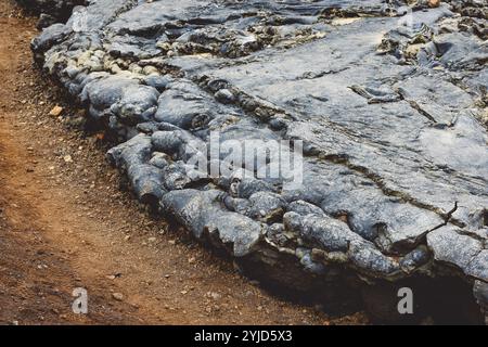 Geldingadalir active Volcano, errupting in 2021, Fagradalsfjall and 2022 -Meradalir. Still hot lava rocks, steam comping up from the grounds. Dark gre Stock Photo