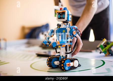 Stem educations,inventor school. School boys planning of innovation robot model in laptop. DIY robot in science education class Stock Photo