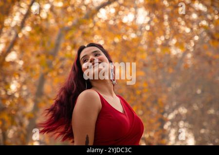 Srinagar, India. 14th Nov, 2024. Indian tourist girl poses for a photo inside a Mughl garden during autumn season in Srinagar, the capital city of the Himalayan region of Kashmir. (Photo by Faisal Bashir/SOPA Images/Sipa USA) Credit: Sipa USA/Alamy Live News Stock Photo