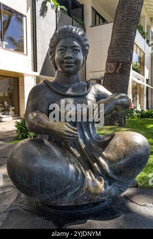 Waikiki, Oahu, Hawaii, USA – February 17 2022: The Storyteller statue is located in the centre of Waikiki Stock Photo