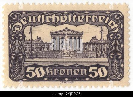 AUSTRIA - 1921 August: 50 krone dark violet on yellow postage stamp depicting Parliament Building, issue of the First Republic. The Austrian Parliament Building in Vienna is where the two houses of the Austrian Parliament conduct their sessions. The building is located on the Ringstraße boulevard in the first district Innere Stadt, near Hofburg Palace and the Palace of Justice. It was built to house the two chambers of the Imperial Council (Reichsrat), the bicameral legislature of the Cisleithanian (Austrian) part of the Austro-Hungarian Empire Stock Photo