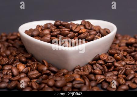 Roasted coffee beans in a white dish Stock Photo