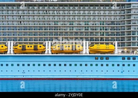 Skagway, Alaska, USA - September 23, 2024: A exterior view of Royal Caribbean’s Ovation of the Seas cruise ship with lifeboats and balconies docked in Stock Photo