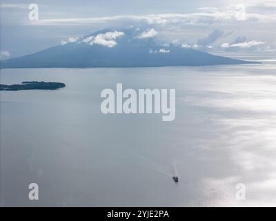 Ferry boat move from ometepe island  in Nicaragua aerial drone view Stock Photo