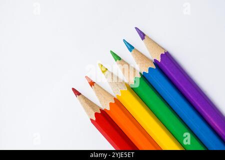 Colored Rainbow Pencils school supplies on white background. Copy space Stock Photo