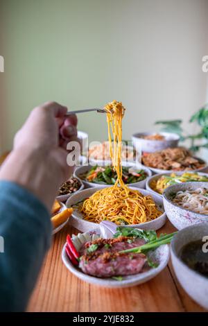 The Khao Soi Yuan Naan that is served on the plate is Khao Soi noodles mixed with minced pork spring onion coriander and chili lime and sesame spicy a Stock Photo