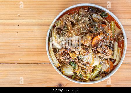 Various kinds of noodles are stir fried together with vegetables and seasoned with mala pepper giving this stir fried noodle dish spicy flavor and mak Stock Photo