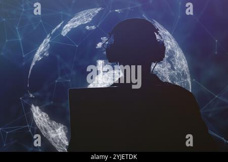 Silhouette of a military man in headphones at a laptop against the background of a digital globe of the earth, contour lighting. Concept: collection o Stock Photo