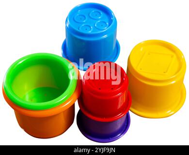 Childrens toy plastic cup pyramid made of multicolored elements Stock Photo